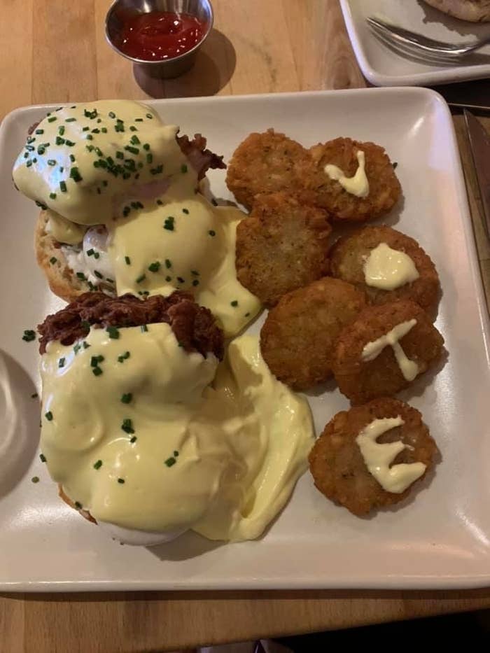 A plate of food shows the word "VOTE" written in hollandaise sauce