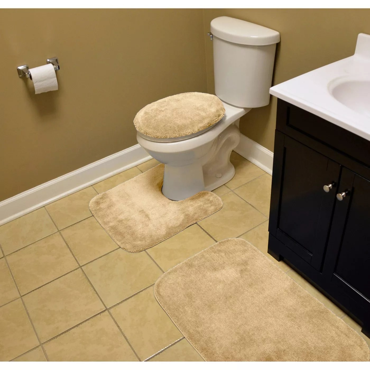 The rugs fitted on top of the toilet seat and placed in front of the toilet and sink