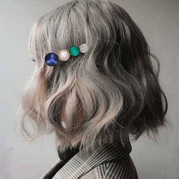 A person wearing one of the hair clips