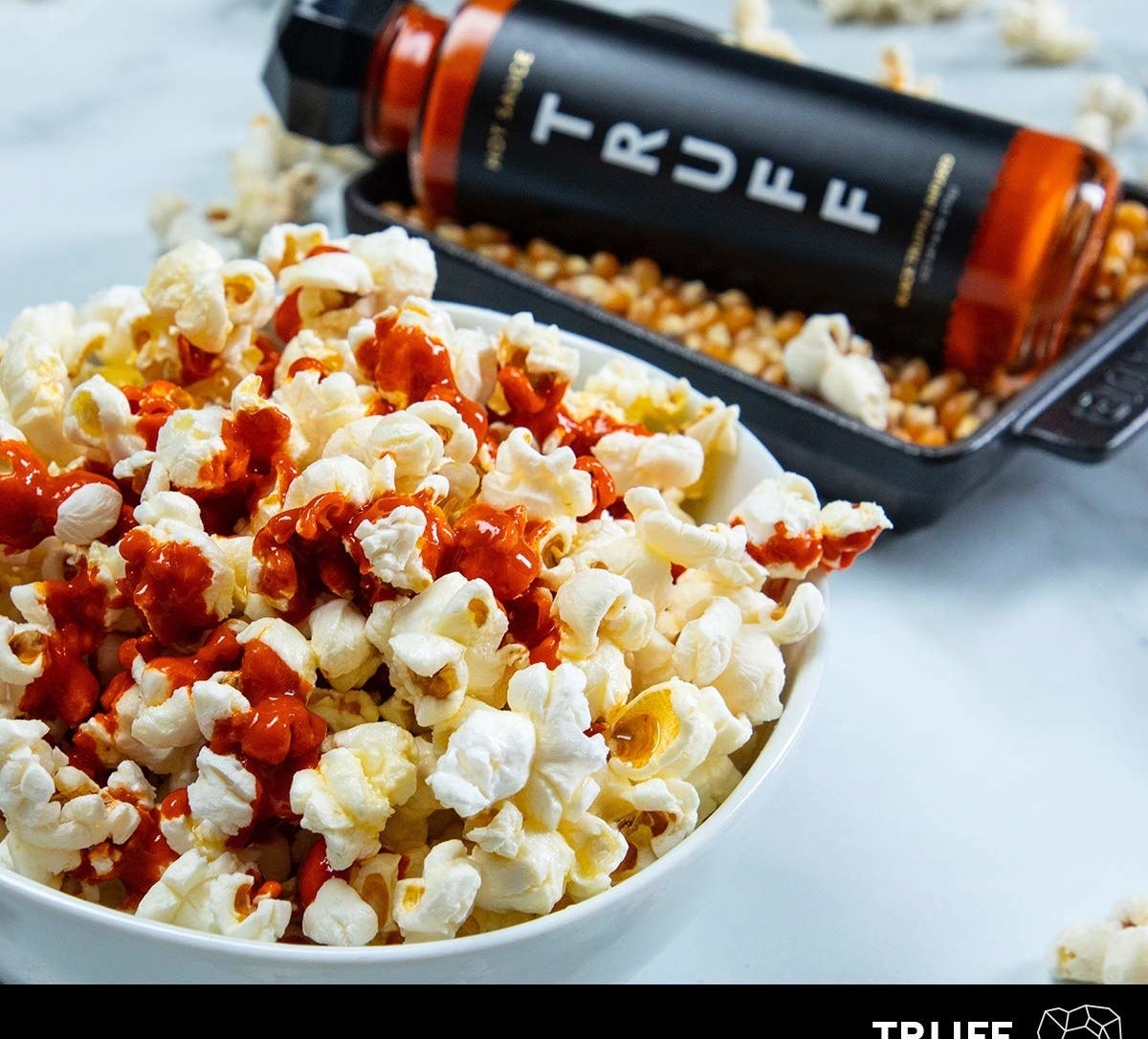 The sauce drizzled on popcorn