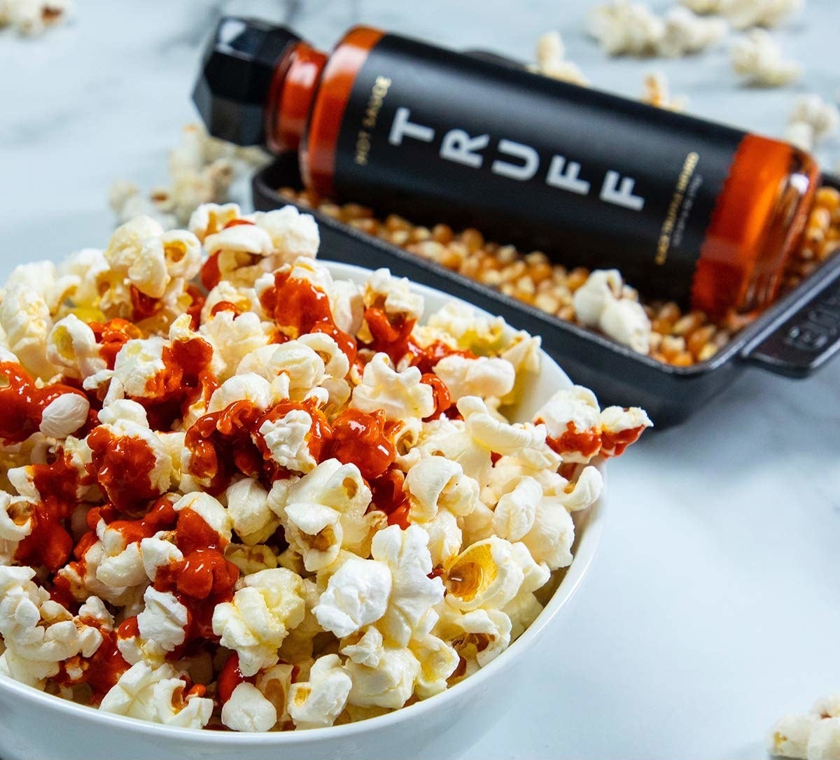 The sauce drizzled on popcorn