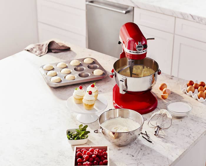 the red kitchenaid mixer and all of the accessories
