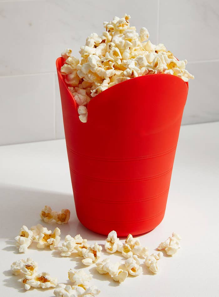 A popcorn container with popcorn in it
