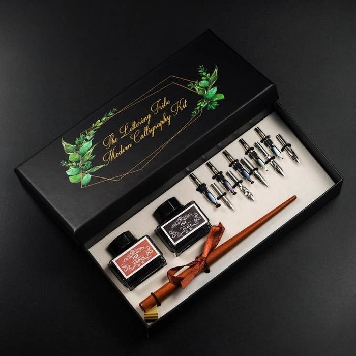 The set with a wooden pen in a pretty box