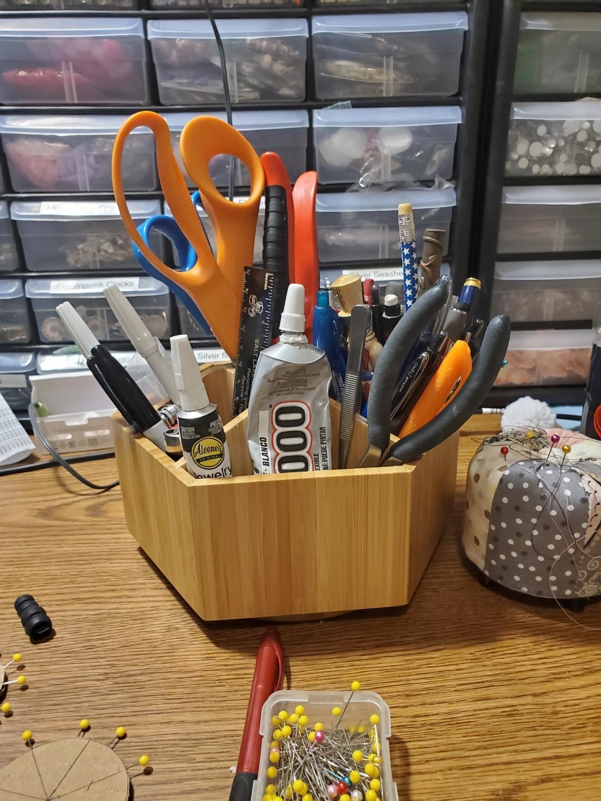 Reviewer image of the rotating bamboo organizer on a craft table
