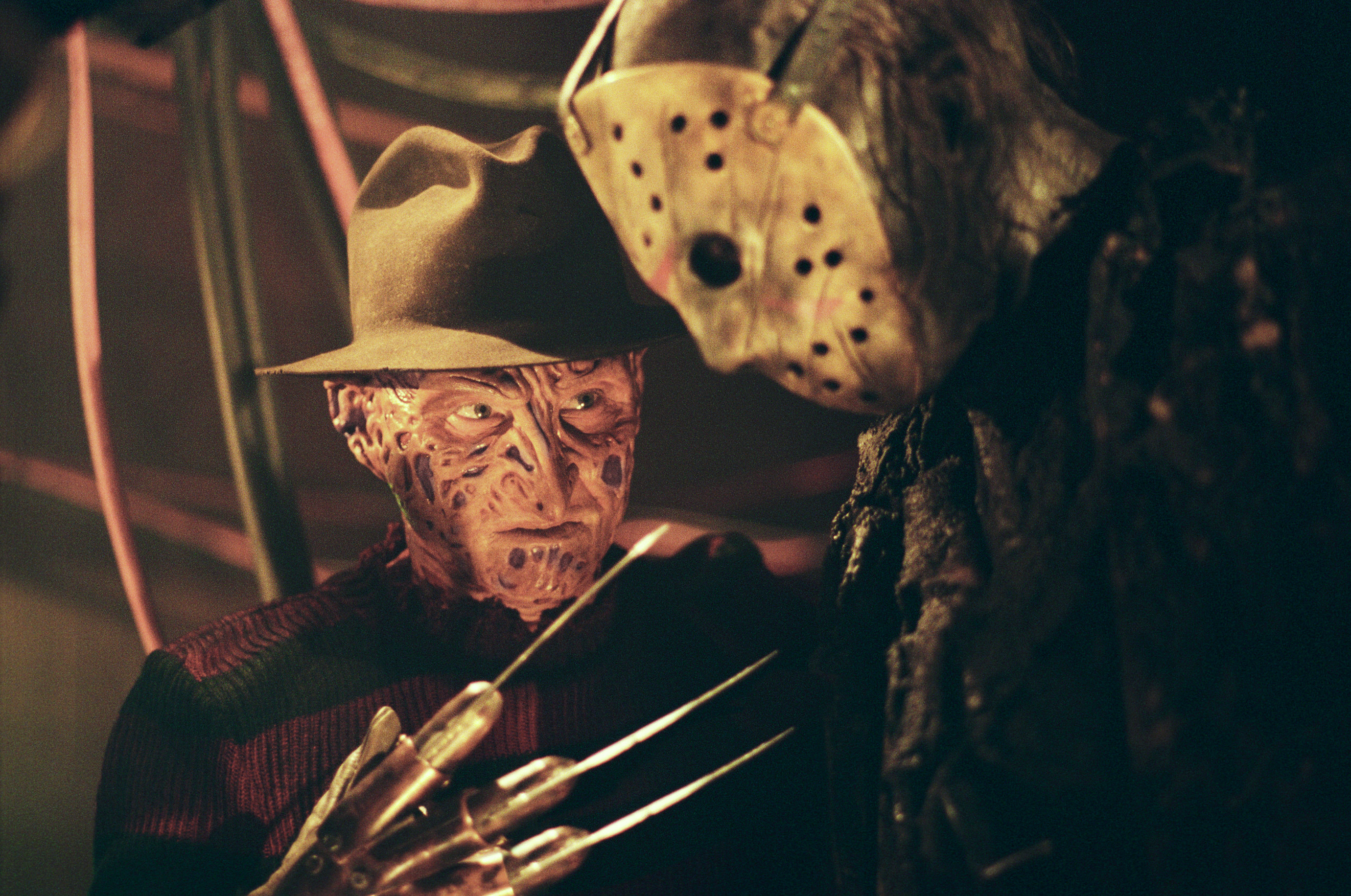 Freddy Krueger holds his bladed glove to Jason
