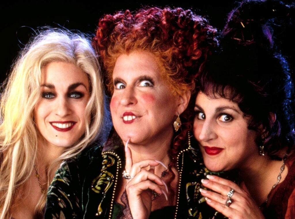 The three main characters from Hocus Pocus smiling at the camera