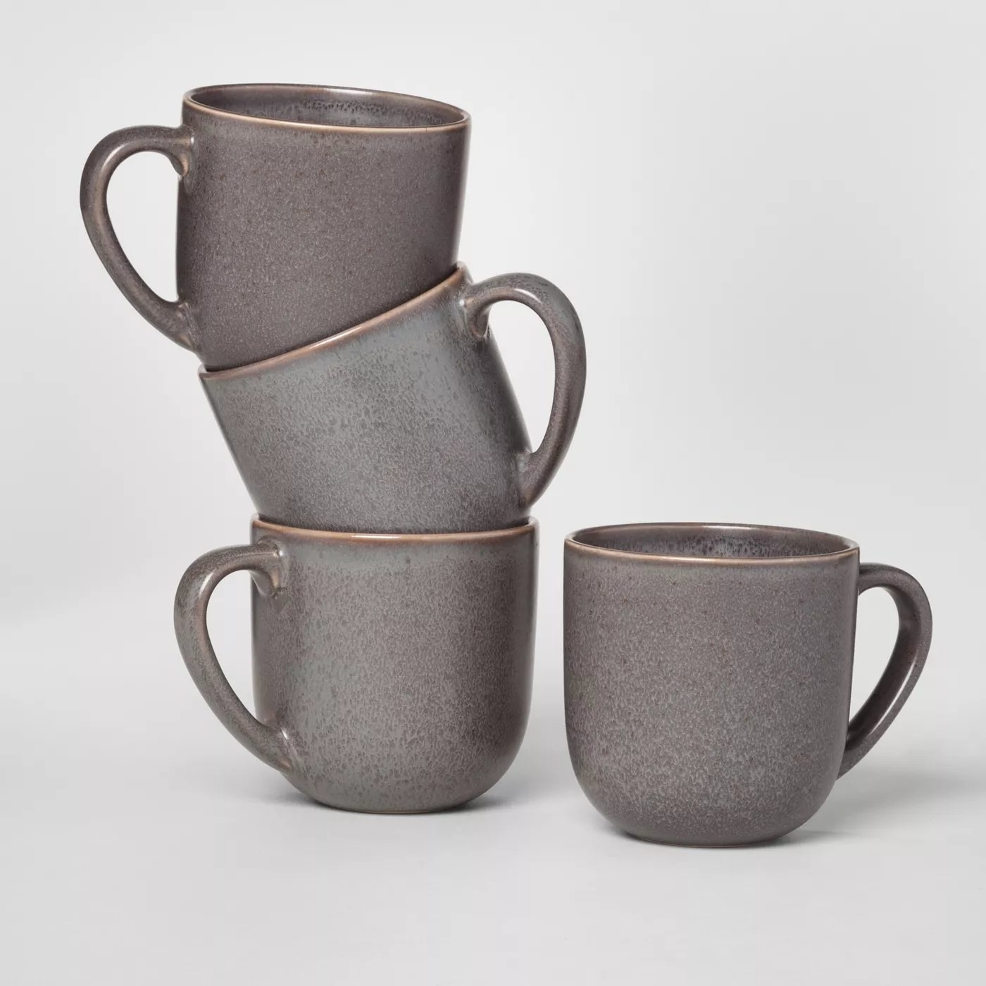 The gray mugs stacked on top of each other