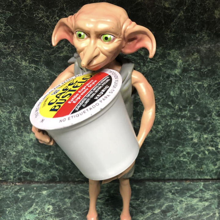 reviewer photo of Dobby holding coffee pod 