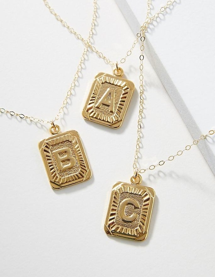Whim monogram pendant necklaces in letters: A, B and C