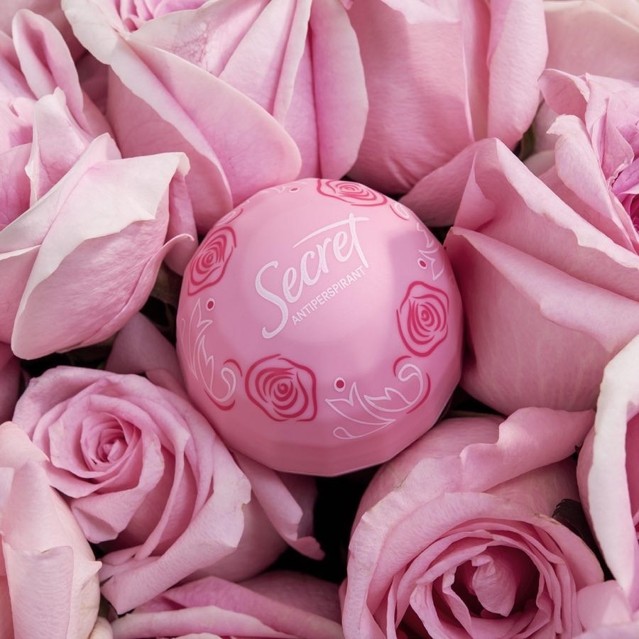 A small ball of solid deodorant on a bouquet of roses