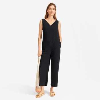 Model wearing the mid-calf length jumpsuit in black