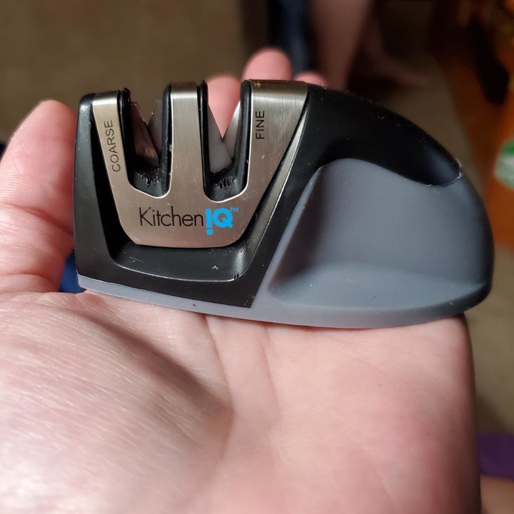 Reviewer holding knife sharpener to show the small size