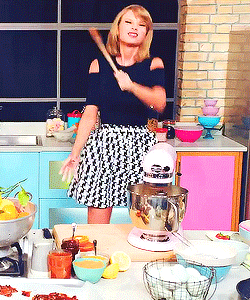 Taylor Swift dancing while baking.