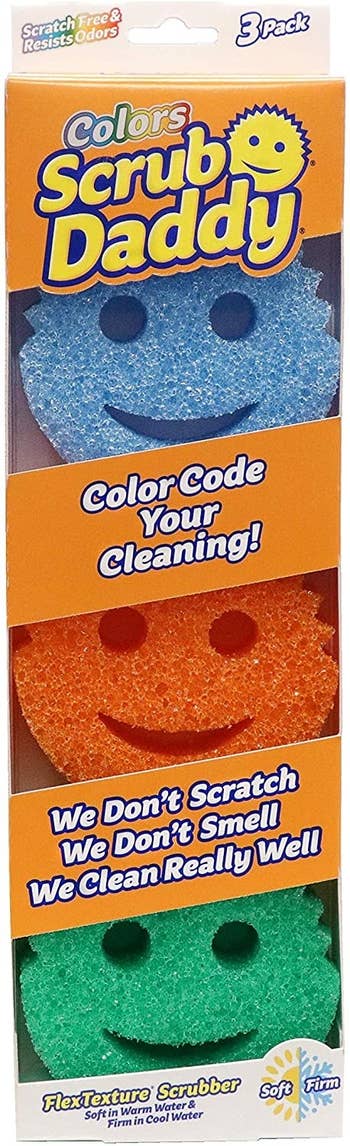 A three-pack of blue, orange, and green Scrub Daddy sponges
