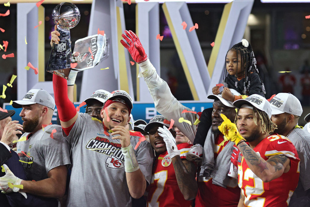 Patrick Mahomes #15 of the Kansas City Chiefs raises the Vince Lombardi Trophy