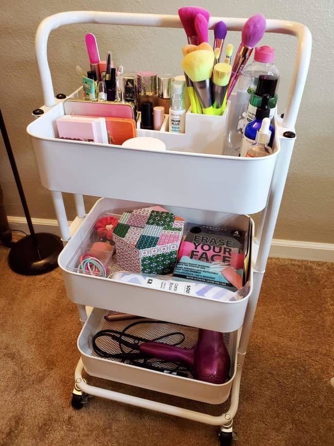 reviewer's white cart filled with beauty products 