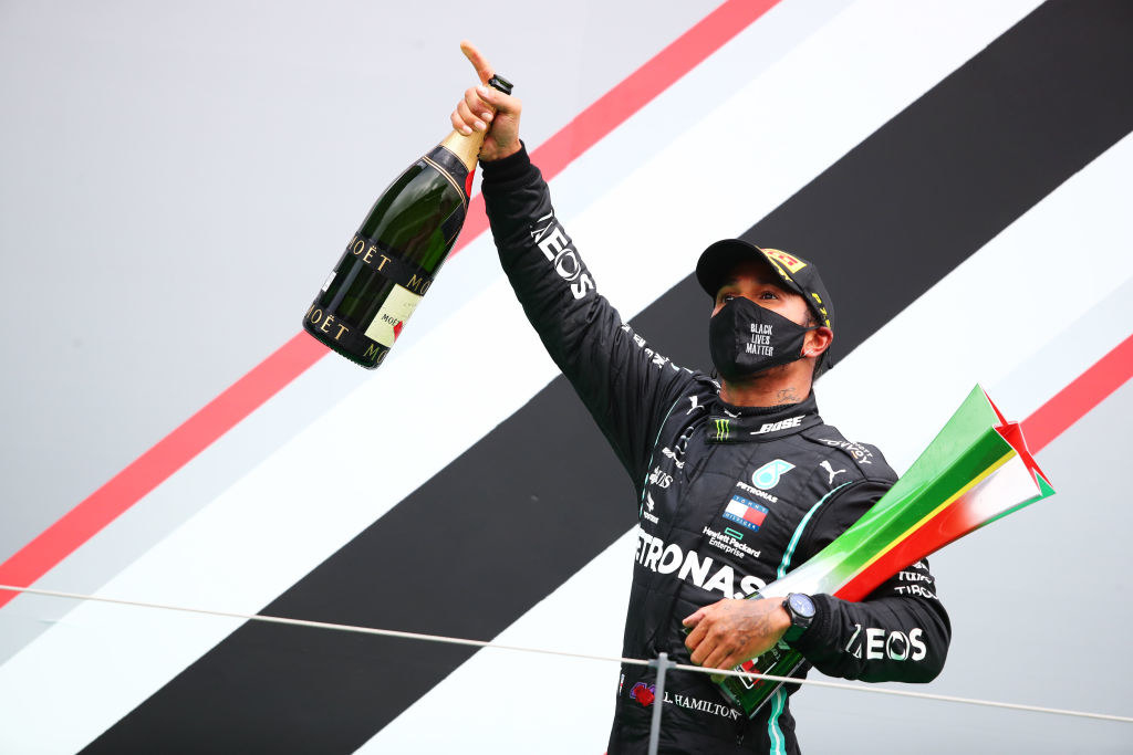 Race winner Lewis Hamilton of Great Britain and Mercedes GP celebrates his record breaking 92nd race win 