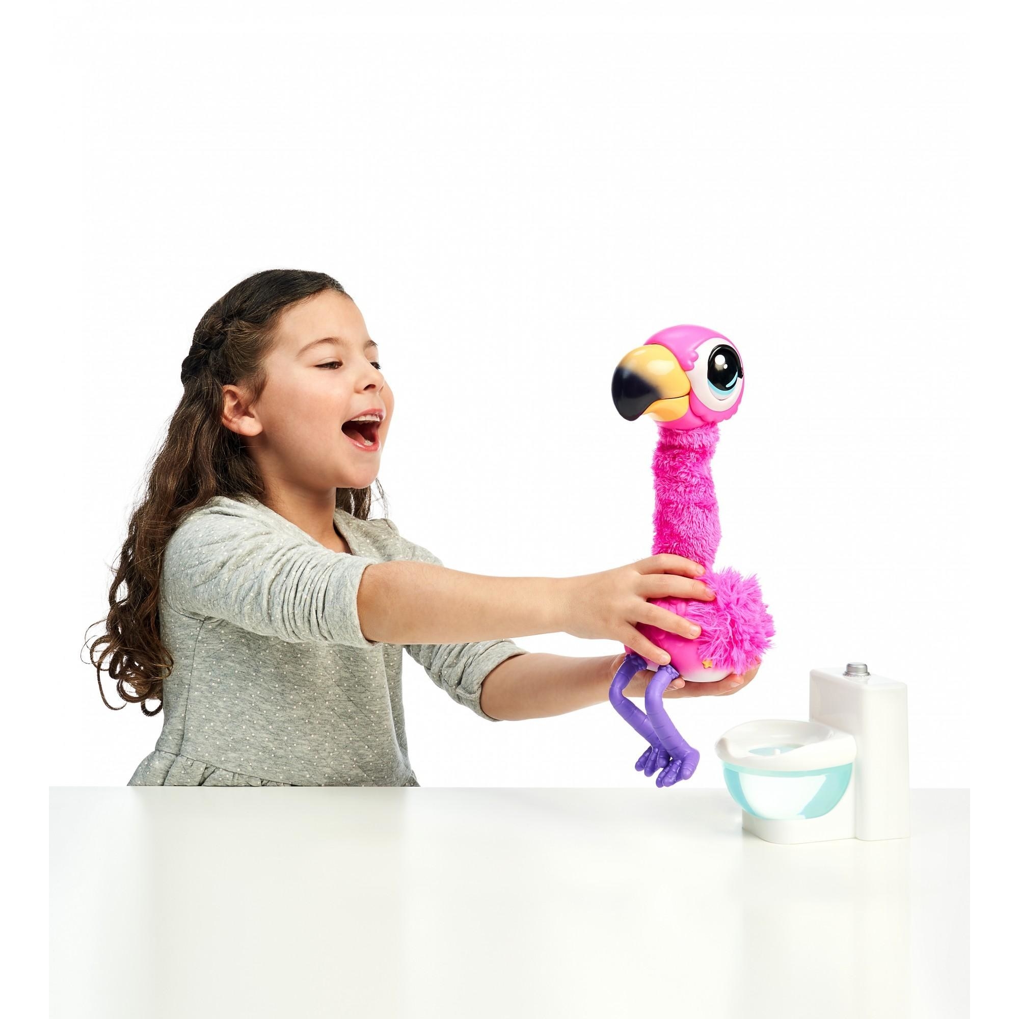 Child playing with Gotta Go Flamingo toy