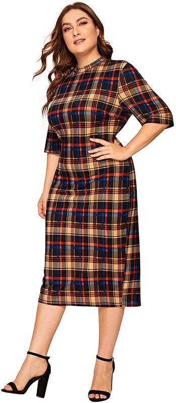 A model wearing the dress in blue, brown, and red plaid