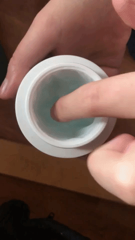 gif of writer dipping her dinger into the blue gel cream