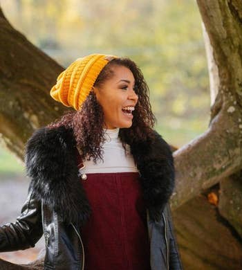 Model wearing the knit hat in yellow