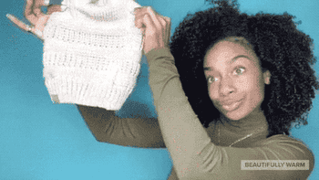 gif of a  model showing the silky lining and how their hair fits in the beanie