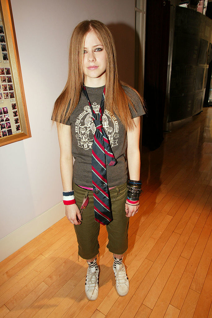 Avril Lavigne in the early 2000s wearing a tie over her t-shirt