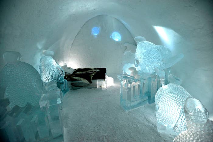 interior of a hotel room made entirely of ice with snow on the ground