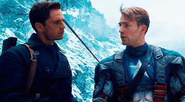 Steve and Bucky looking at each other in the snow in Captain America