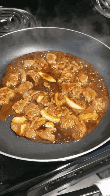 A GIF of the cut galbi sizzling on the skillet