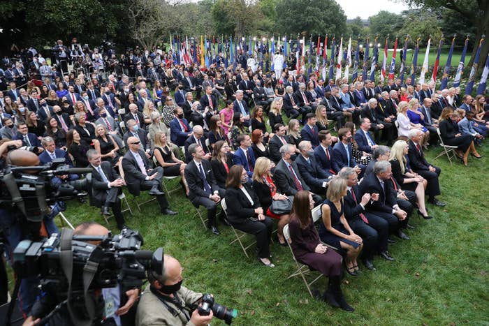 More than 150 guests sit packed together without masks as Amy Coney Barrett is introduced by President Donald Trump as his nominee to serve of the Supreme Court