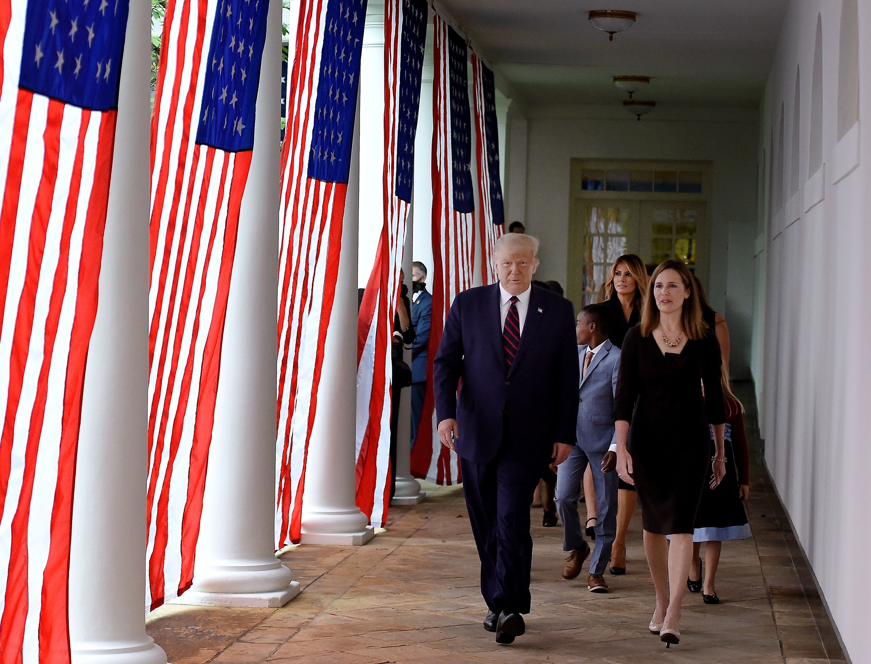 Trump and Barrett emerge from inside the White House to introduce her as a nominee to serve in the Supreme Court