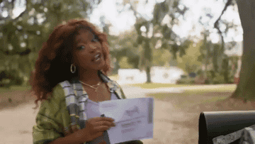 GIF of Keke placing her election ballot in the mailbox