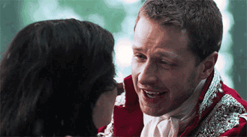 On Once Upon a Time, Charming and Snow look at each other happily in the snow