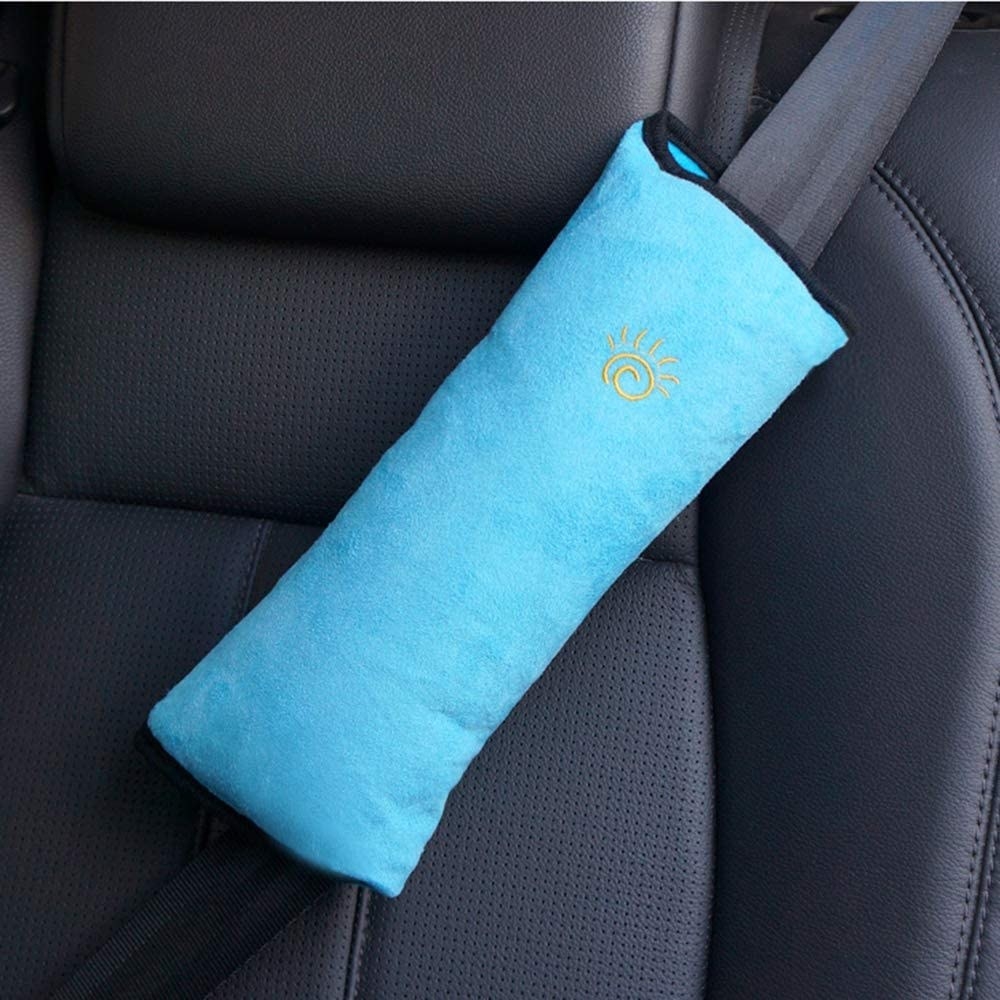 The seat belt cover attached to a seat belt