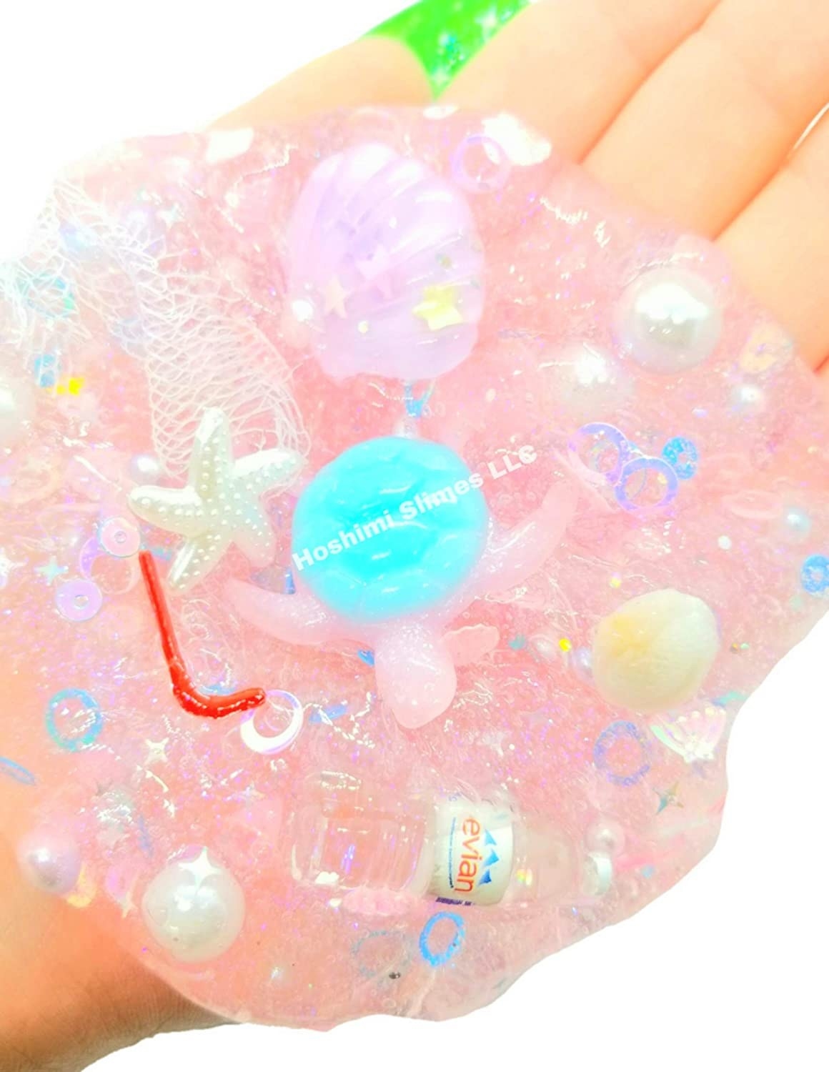 hand with charm-filled slime