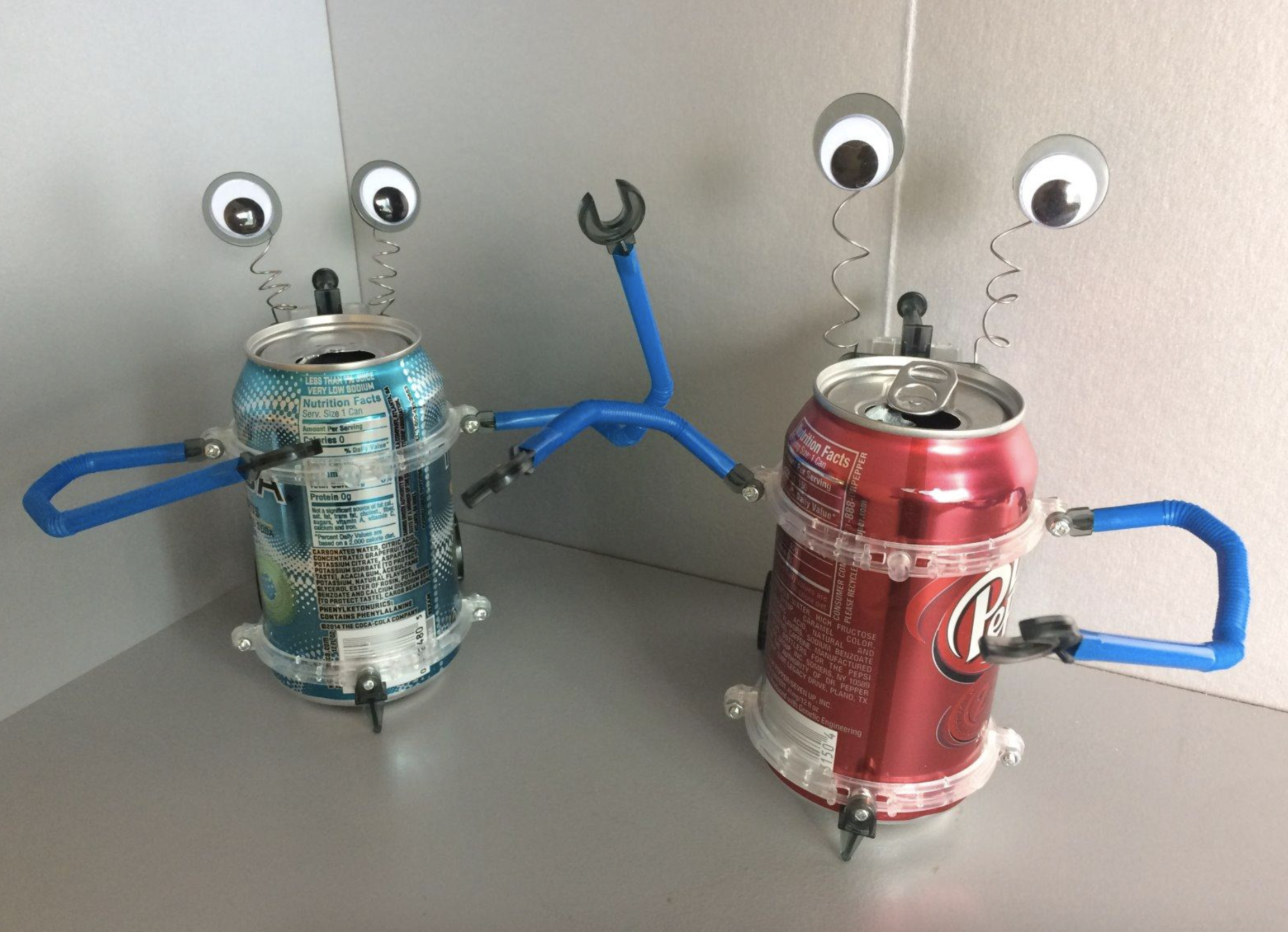 reviewer images of two cans turned into robots