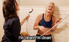 A gif of Amy Poehler from Baby Mama shouting, I&#x27;m clean while Tina Fey hoses her down