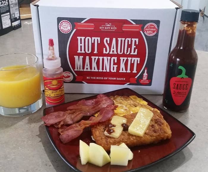 Reviewer photo of the kit and their homemade hot sauce on their breakfast