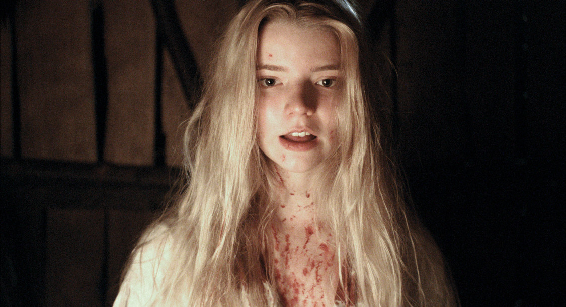 A young girl performing a witch ritual while covered in blood