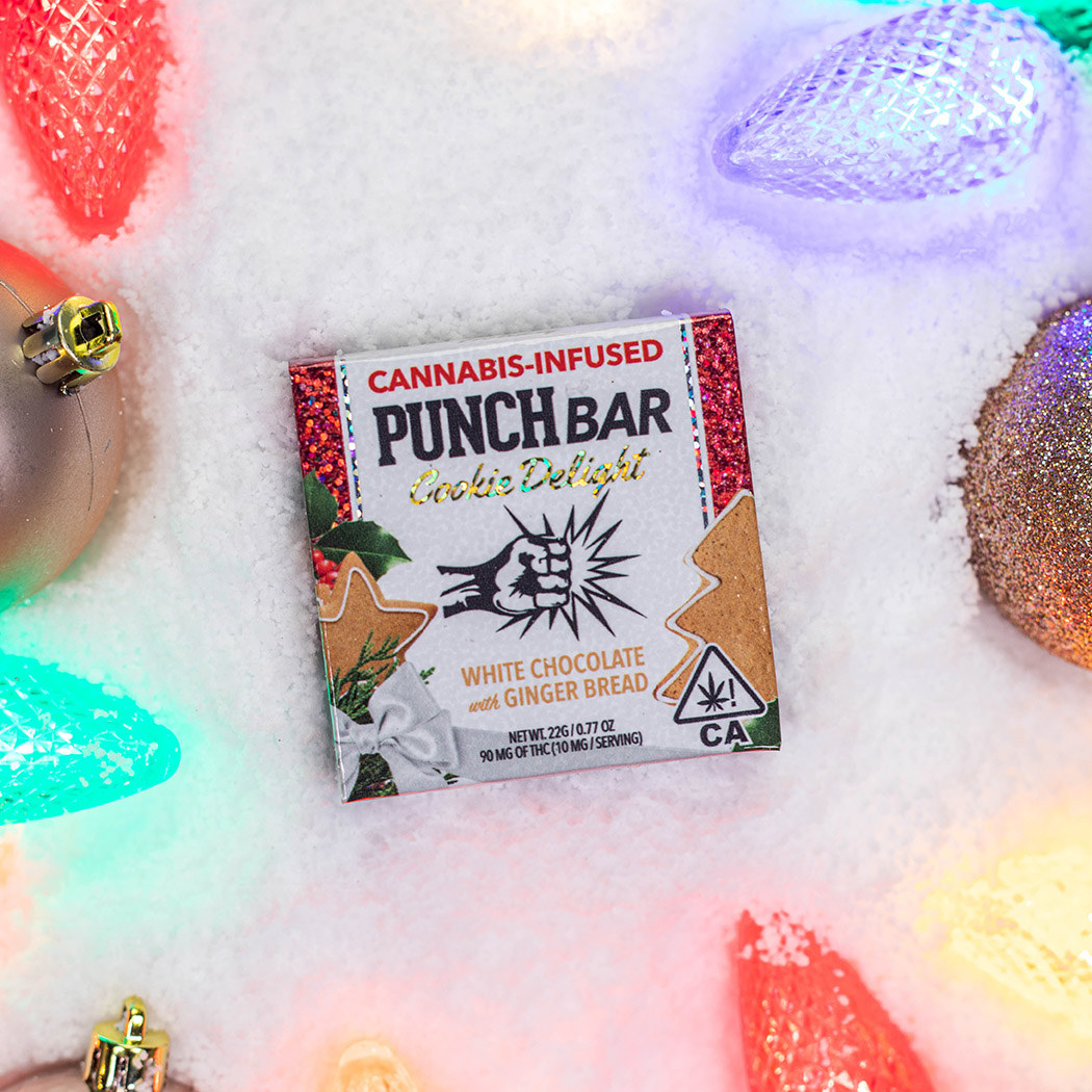 White chocolate with ginger bread PUNCH bar surrounded by holiday lights and atop artificial snow
