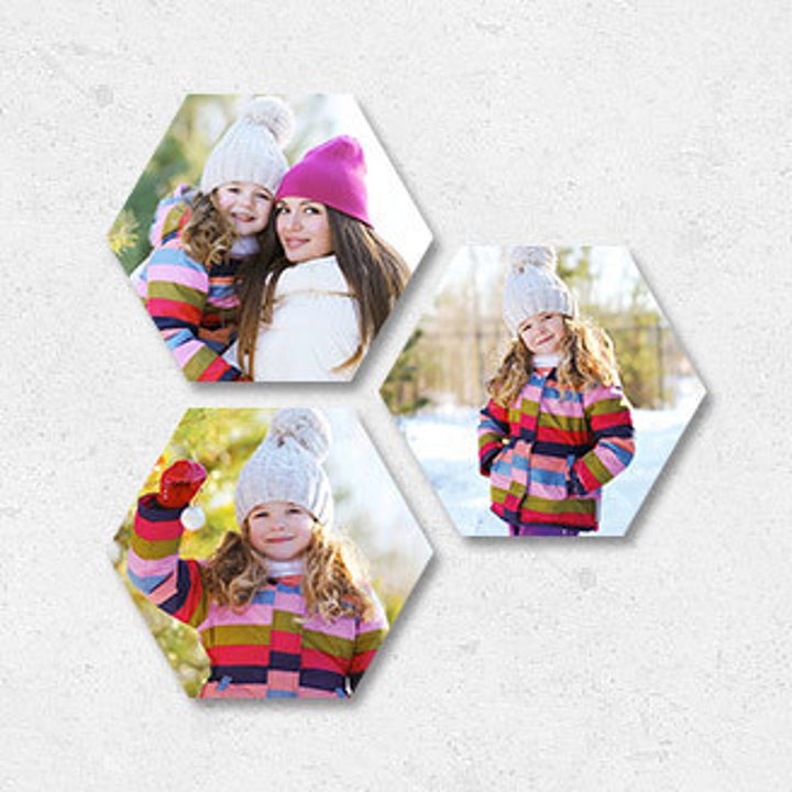 Three hexagonal prints of a mom and kid in the snow