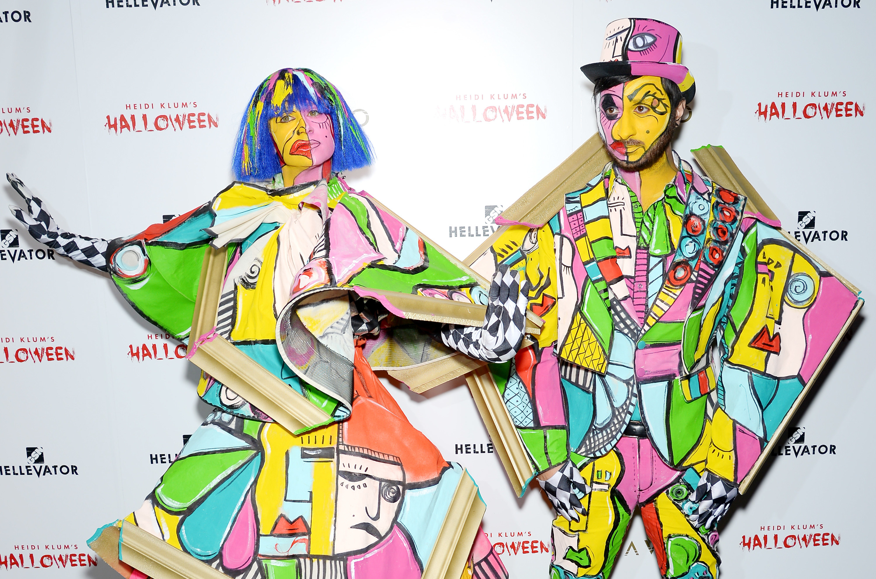 Christian Siriano and a man in wildly geometric costumes that look like cut up paintings. 