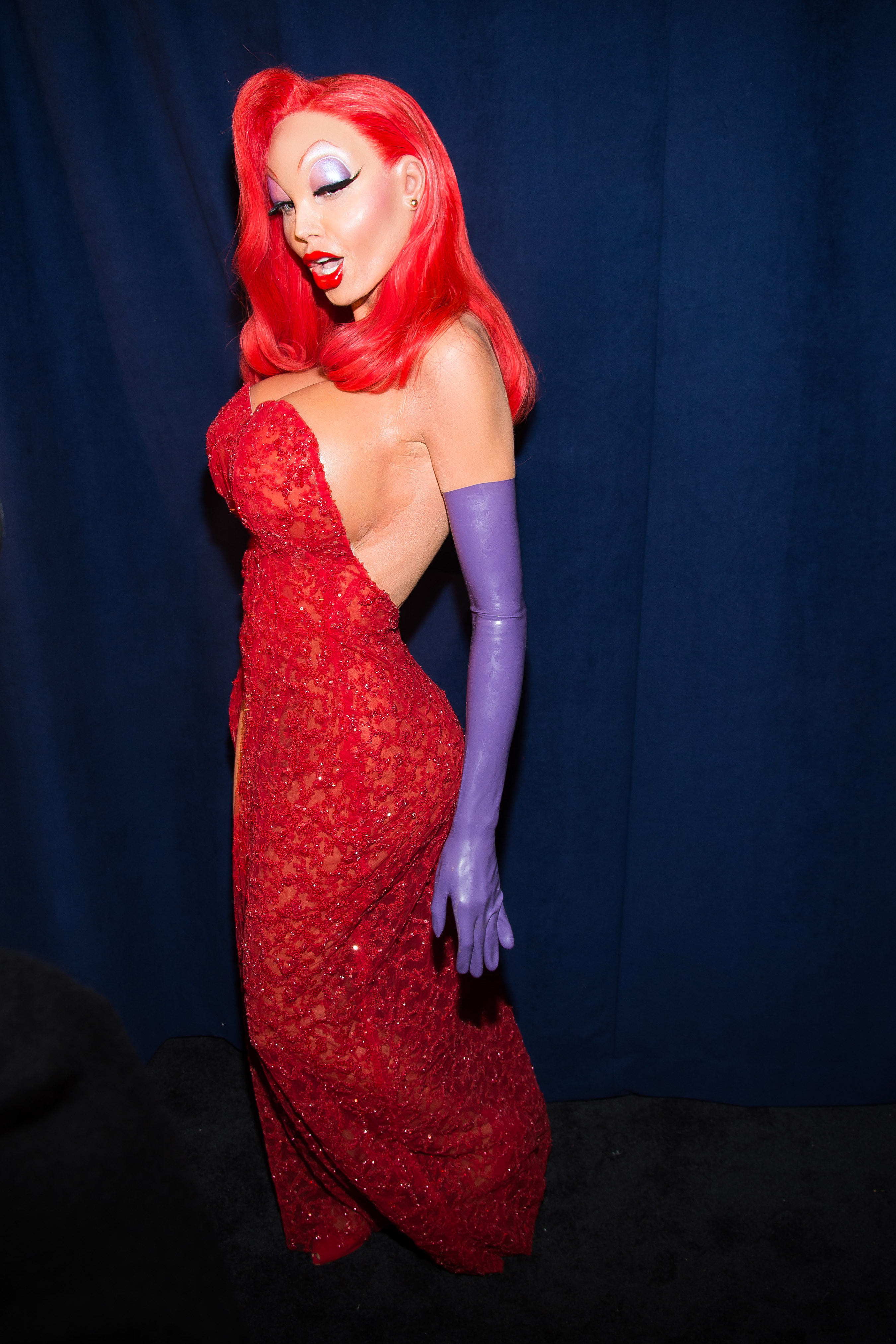 Heidi Klum with heavy prosthetics as Jessica Rabbit in a red dress.
