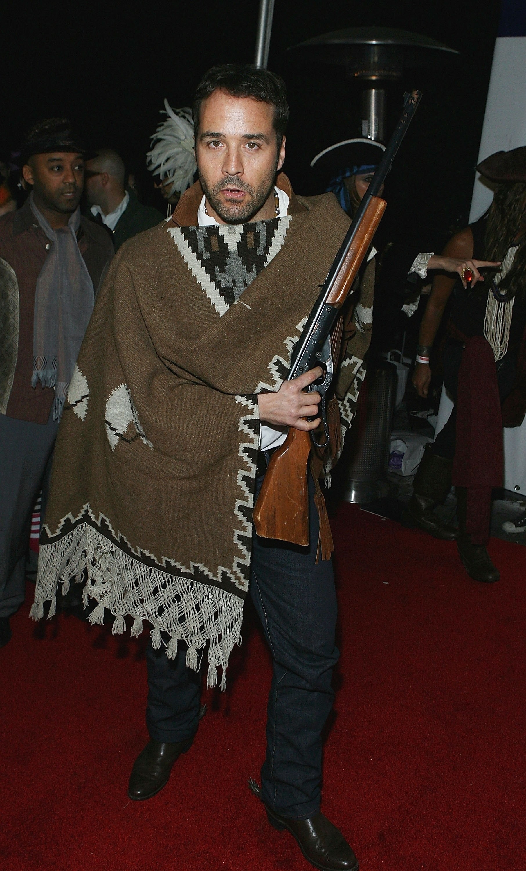 Man dressed like Tuco from The Good, The Bad, The Ugly (poncho and western boots).