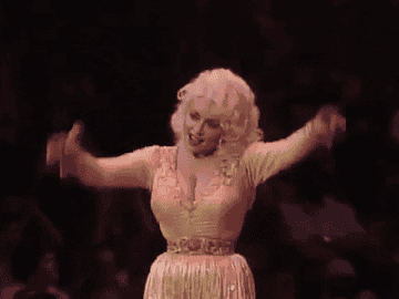 GIF of Dolly raising her arms in triump