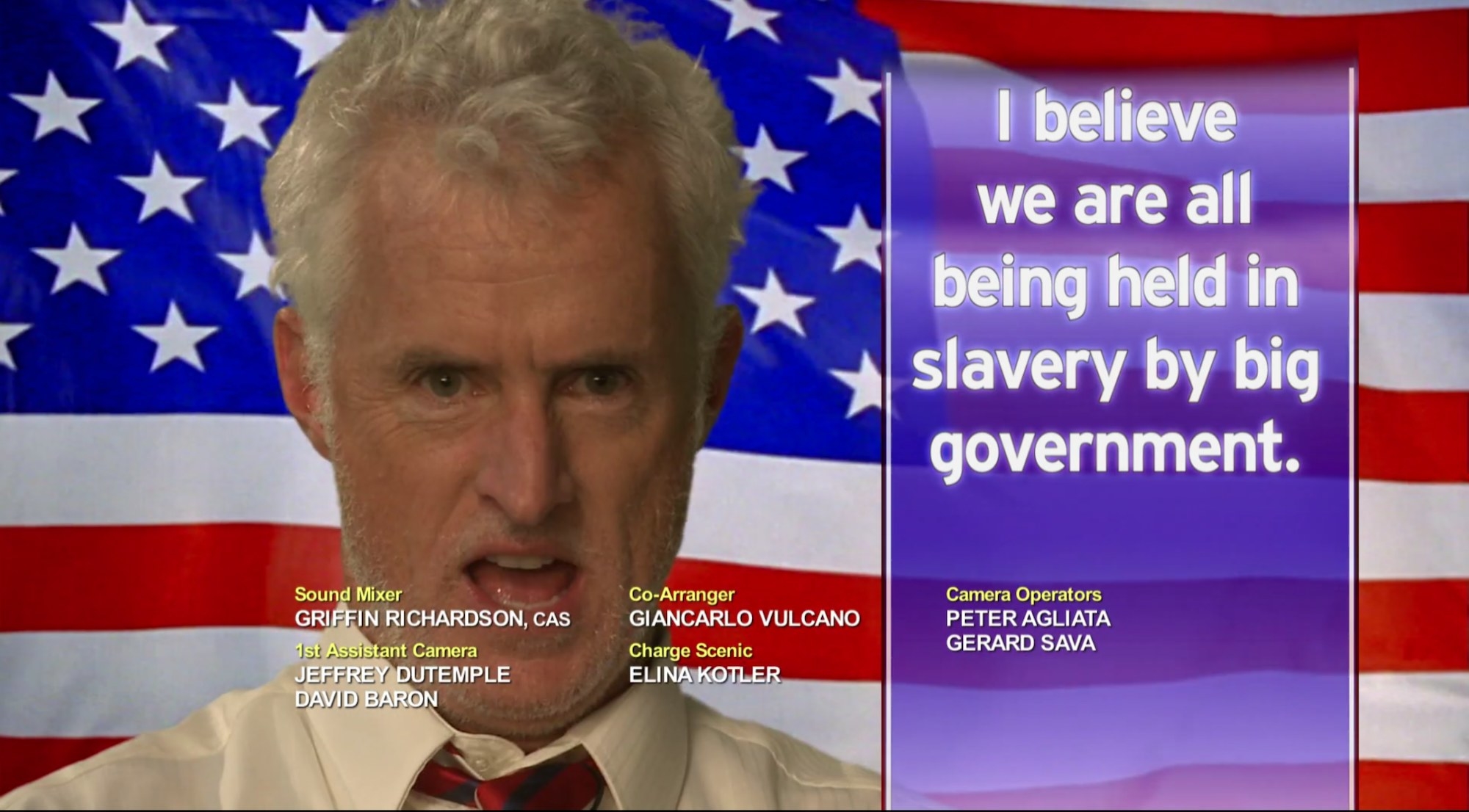 A man in front of an American flag with the side text &quot;I believe we are all being held in slavery by big government&quot; and credits at the bottom.