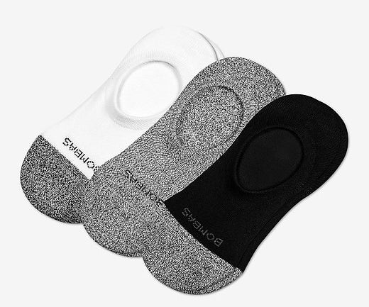 Three pairs of Bombas no-show socks in black, gray, and white