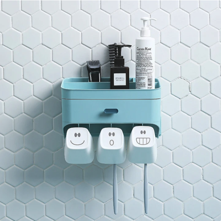 The light blue holder with two toothbrushes and various toiletries 